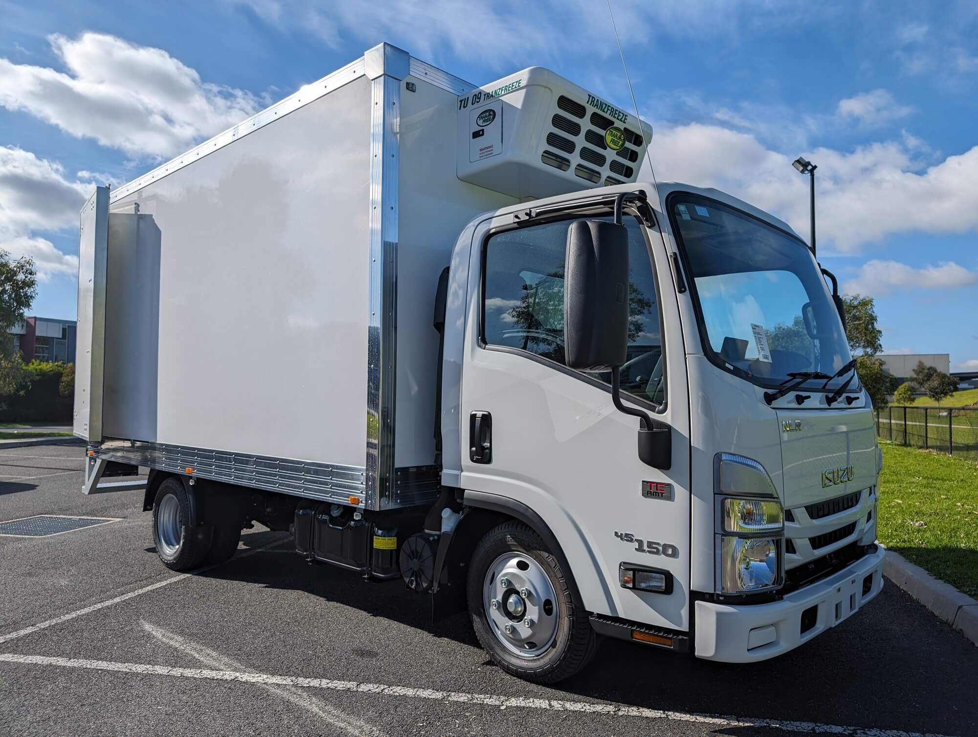 Isuzu refrigerated truck, front three-quarter view