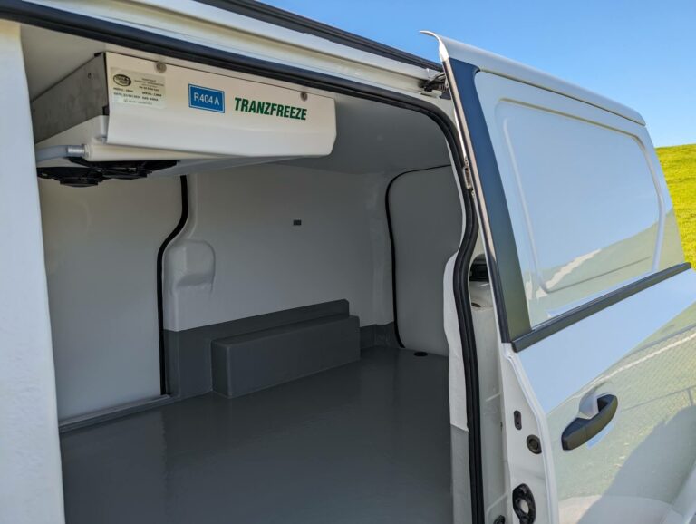 Refrigerated van interior with a Tranzfreeze evaporator above the side door