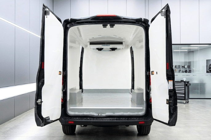 Refrigerated van with rear doors open showing the insulated body and Tranzfreeze evaporator unit