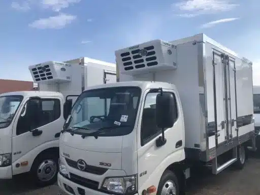 Hino 300 refrigerated truck, front three-quarter view