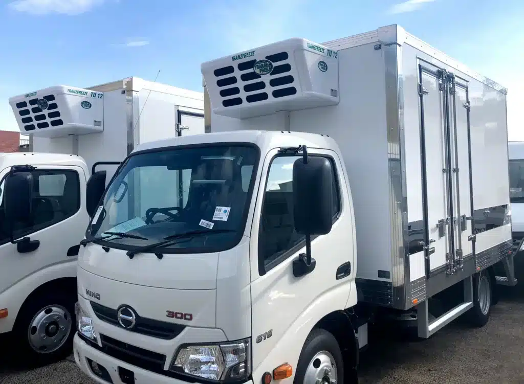 Two Hino 300 trucks with Tranzfreeze refrigerated bodies