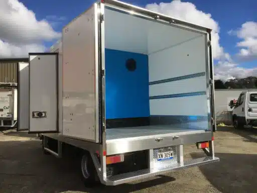 Refrigerated truck body with the side and rear doors open