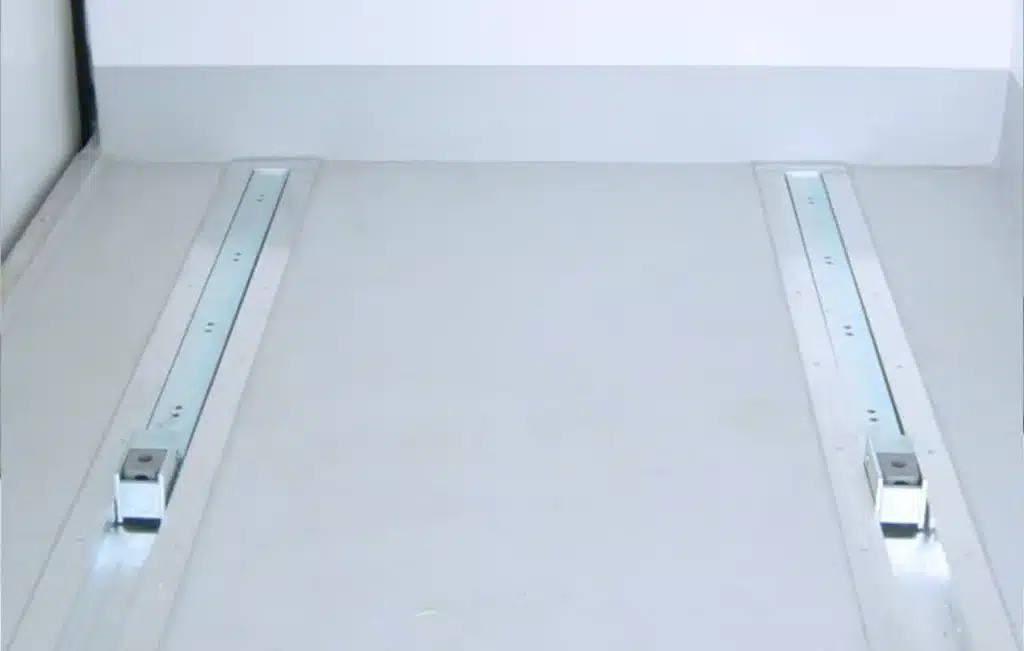 Pallet skate rails fitted to a refrigerated vehicle floor