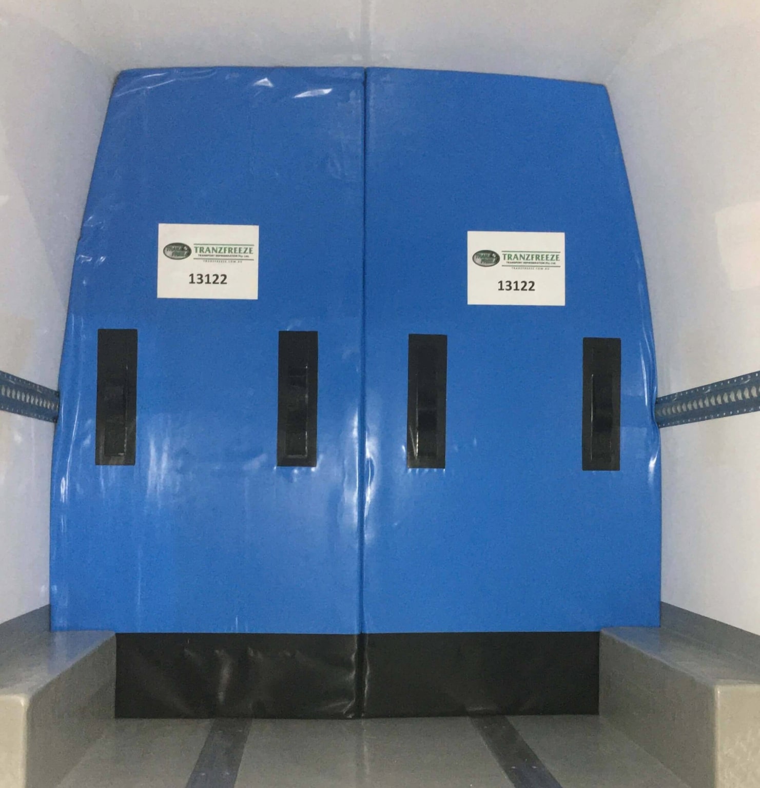 Insulated divider wall that splits a refrigerated van into two temperature zones